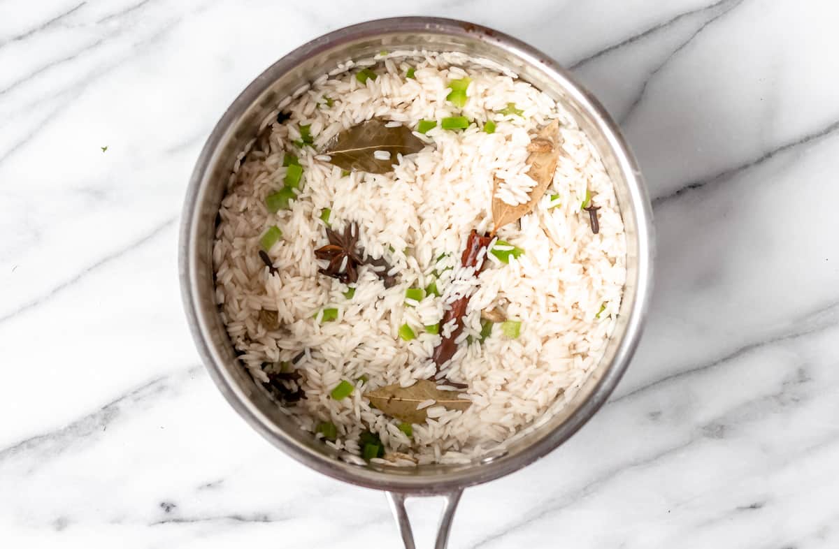 Cooked biryani rice in a saucepot.