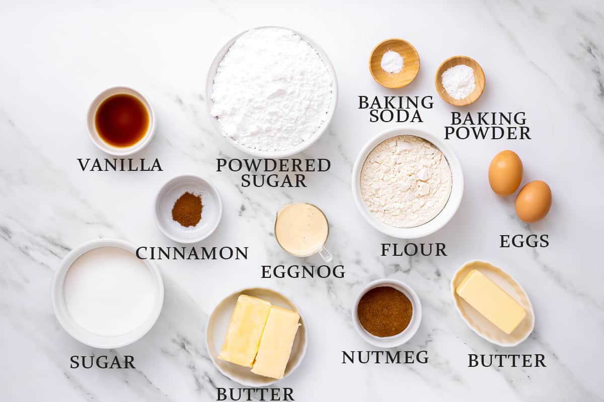 Ingredients needed to make eggnog cupcakes and buttercream frosting with text overlay.