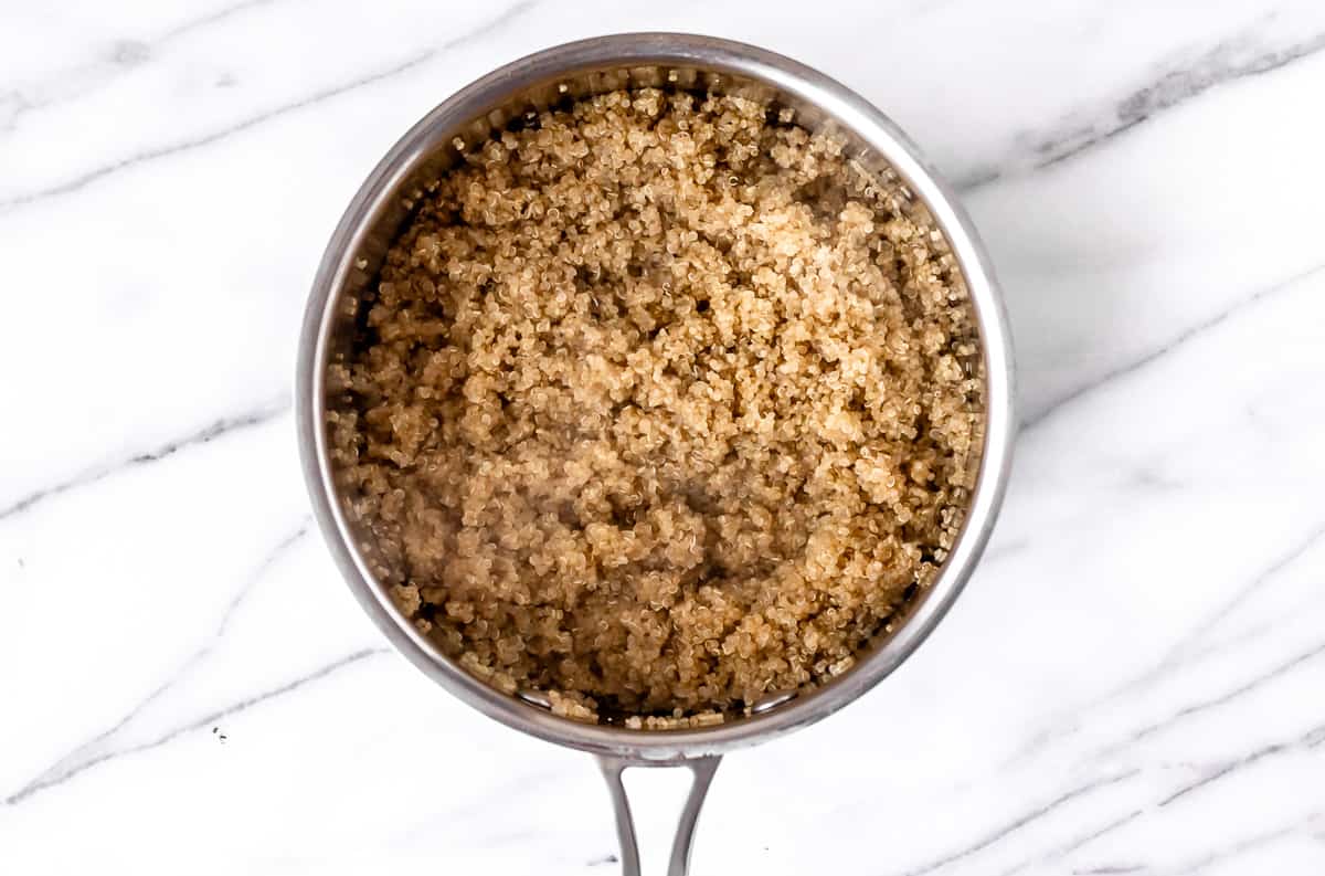 Cooked quinoa in a sauce pot.