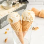 Two ice cream cones filled with maple walnut ice cream with text overlay.