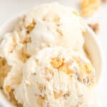 Close up of maple walnut ice cream in a bowl with text overlay.