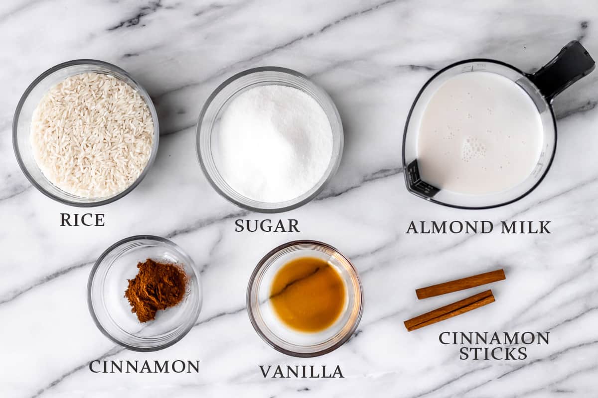 Ingredients to make almond milk horchata with text overlay.