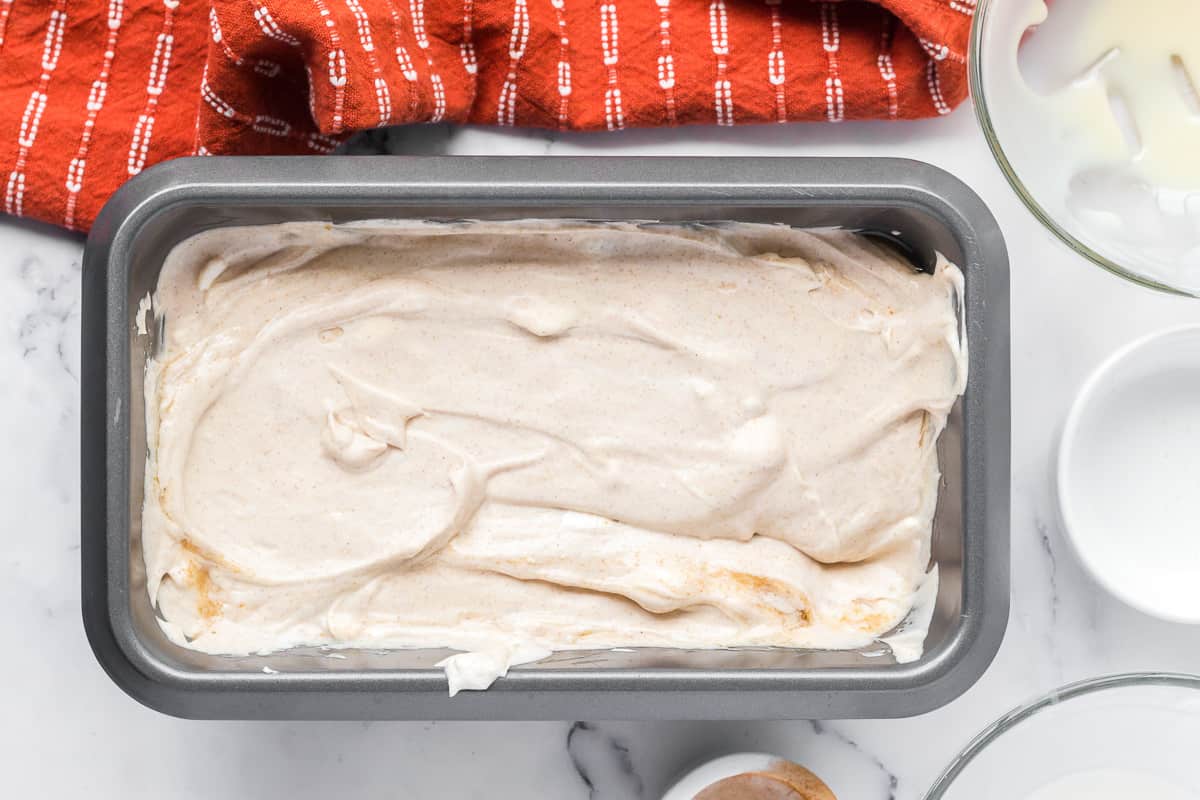 Cinnamon ice cream in a loaf pan prior to freezing.