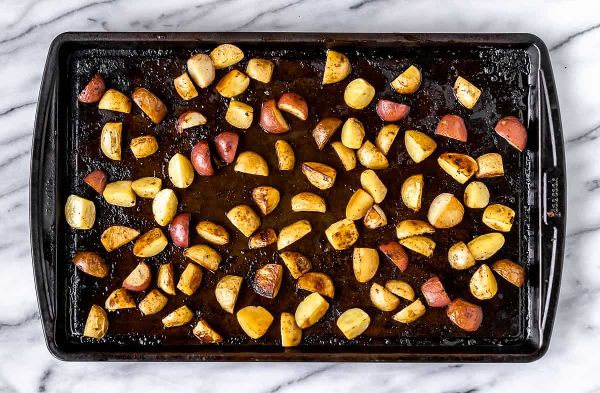 Roasted potatoes on a baking sheet.