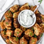 Greek zucchini fritters with text overlay.