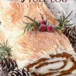 A gingerbread yule log with text overlay.