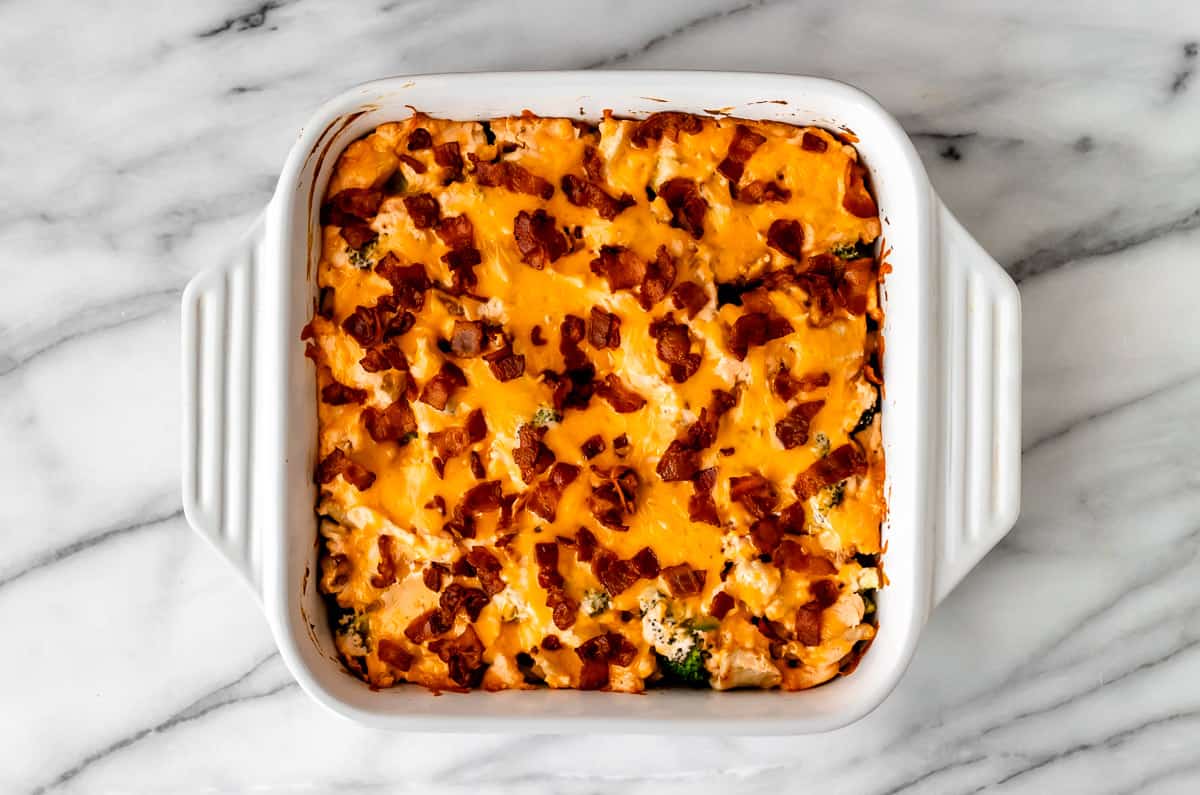 A baked Ranch Bacon Chicken Casserole in a white casserole dish.