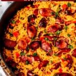 Sausage and spaghetti squash skillet with text overlay.
