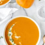 Honeynut squash soup in a bowl with text overlay.