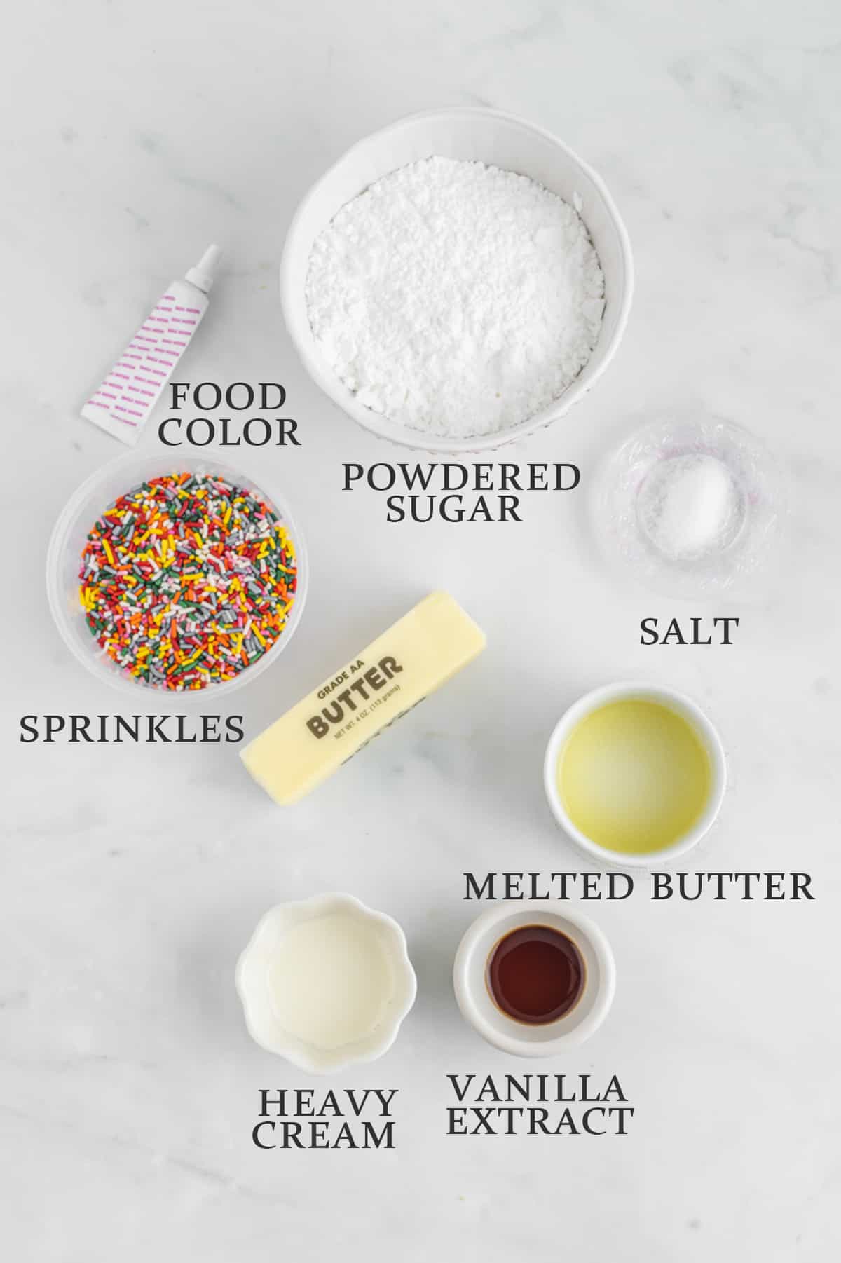 Ingredients to make buttercream frosting for cookies on a white background with text overlay that reads the names of each ingredient.