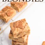 A stack of biscoff blondies with text overlay.