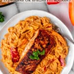 Cajun Salmon Pasta on a plate with text overlay.