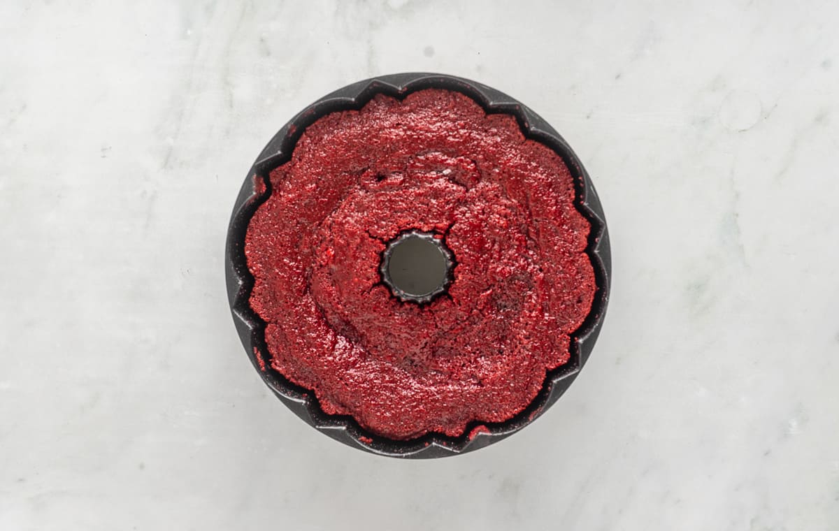 A baked red velvet pound cake in a bundt pan.