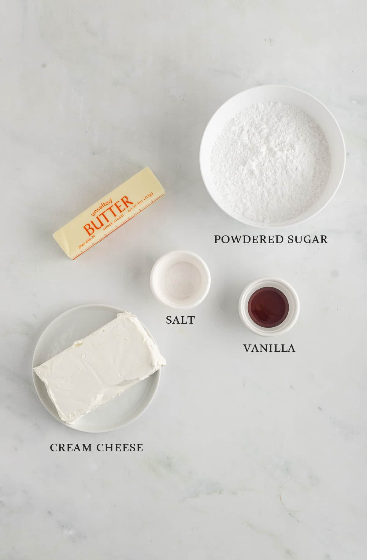 Ingredients needed to make cream cheese frosting on a white background with text overlay.