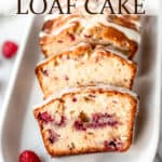 A white chocolate raspberry loaf cake with a couple of slices taken out of it on a white serving plate and fresh raspberries around it with text overlay.