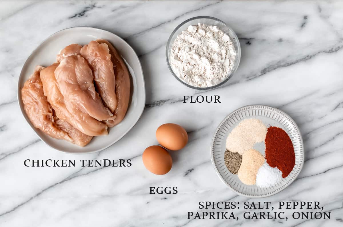 Ingredients to make air fryer chicken tenders with text overlay.