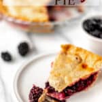 A slice of blackberry pie on a small plate with a fork with text overlay.
