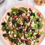 A spinach blackberry salad with text overlay.