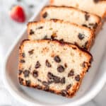 Close up of slices of chocolate chip pound cake layered on each other.