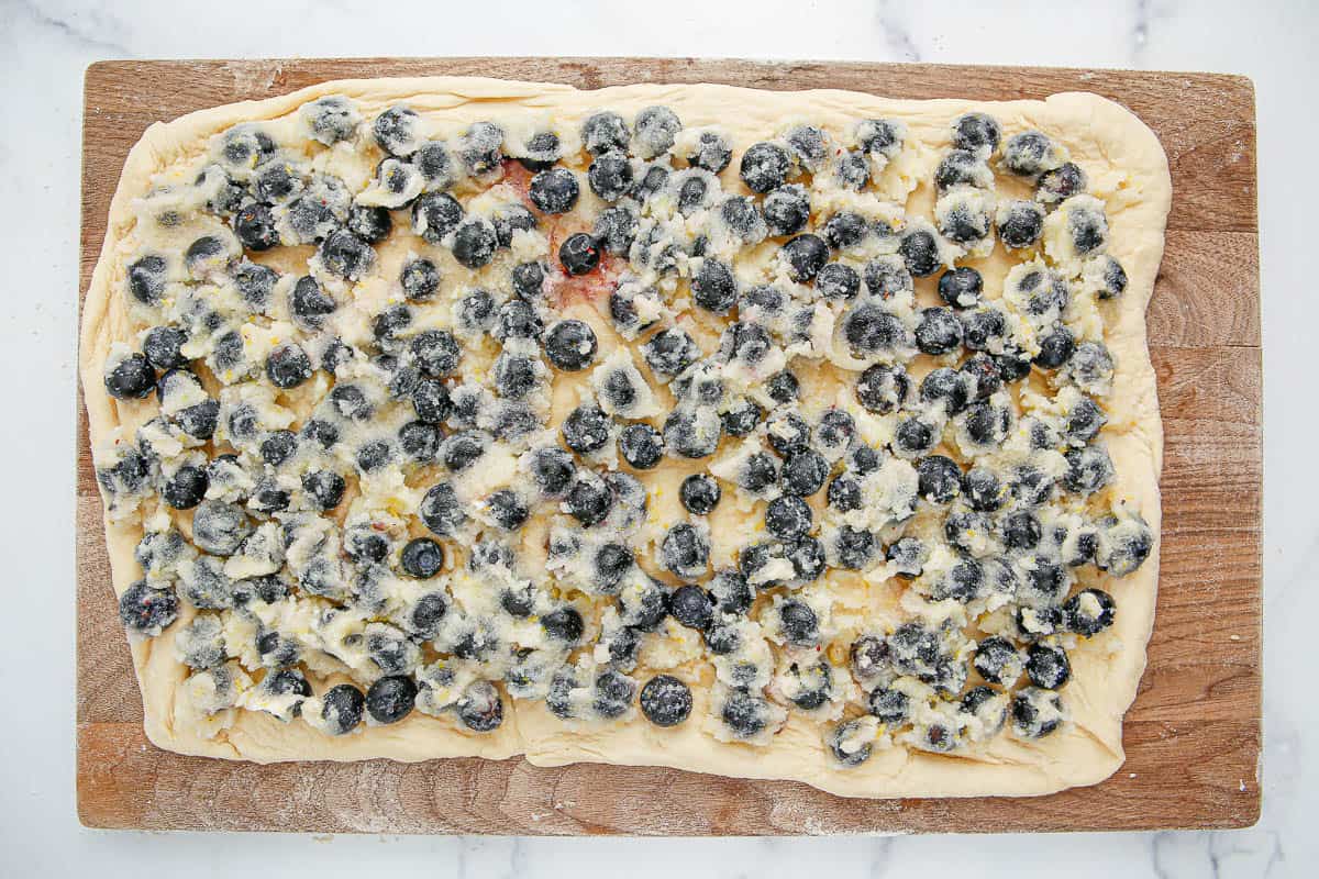 Lemon blueberry mixture spread out onto a rectangle of dough.