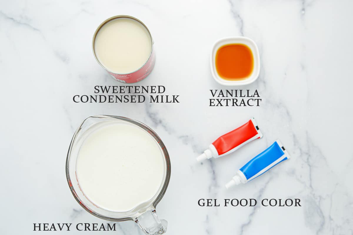 Ingredients needed to make red, white and blue ice cream on a marble background with text overlay.