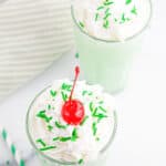 Two green Shamrock Shakes with text overlay.