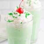 Two green Shamrock Shakes with text overlay.
