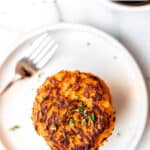 Sweet potato hash browns on a plate with a fork with text overlay.