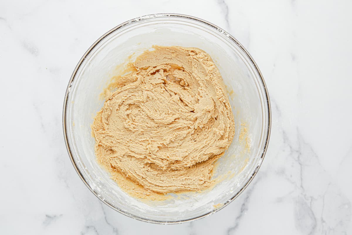 Cookie dough batter in a glass bowl.