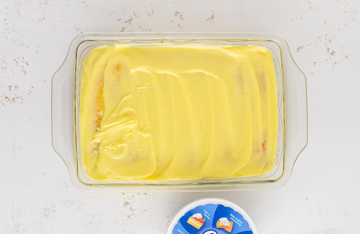 Pudding spread over a lemon cake.