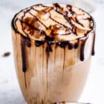 Close up of a an iced mocha latte with text overlay.