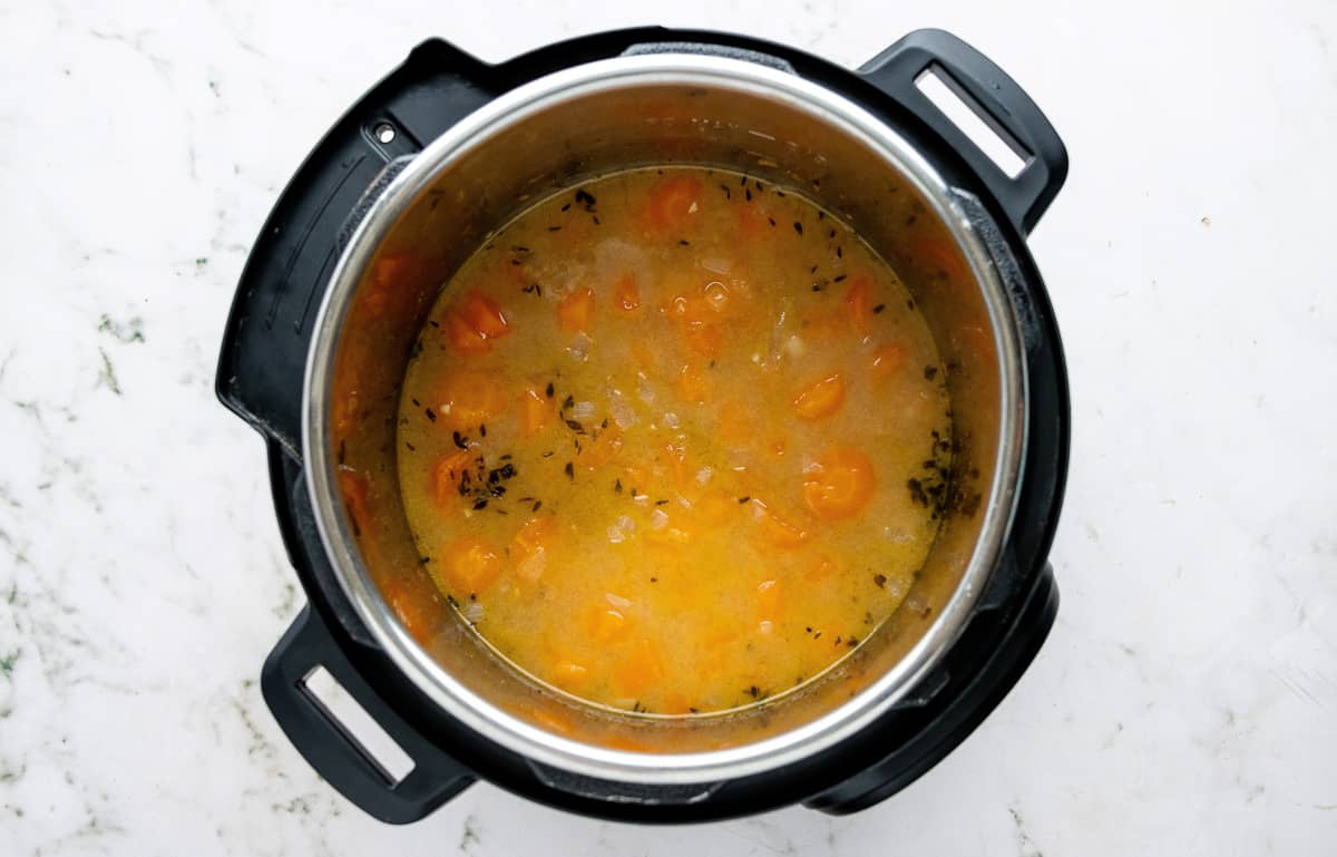 Cooked carrot soup in an Instant Pot prior to pureeing.