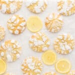 Lemon crinkle cookies and lemon slices with text overlay.