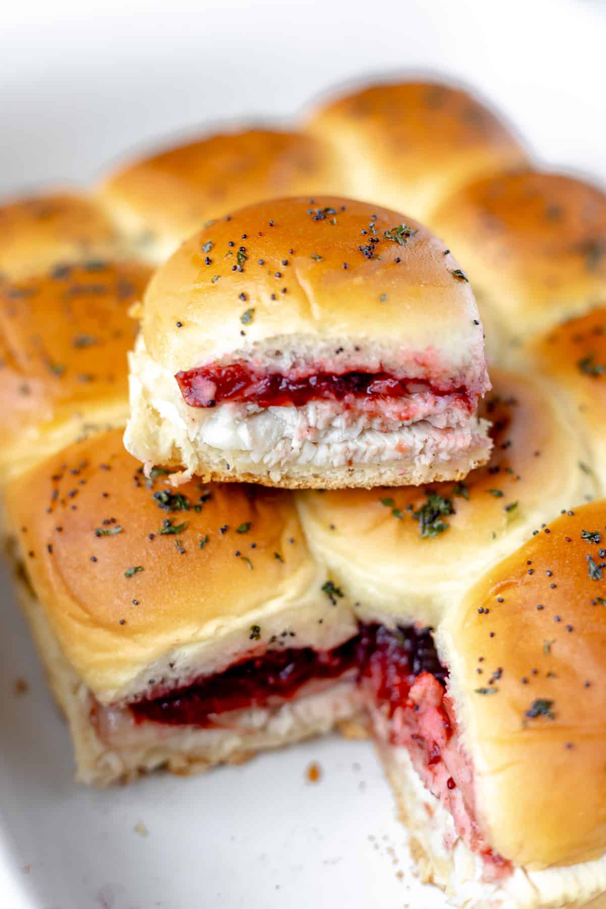 A turkey slider sitting on top of more turkey sliders.