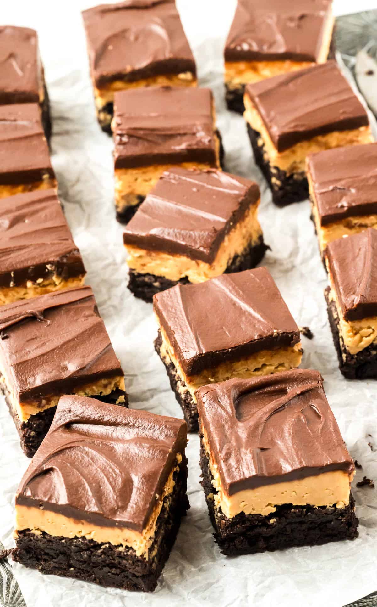 Squares of buckeye brownies on a serving tray.