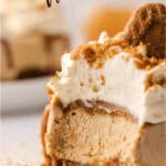 Close up of a mini Biscoff cheesecake with a bite taken out with text overlay.