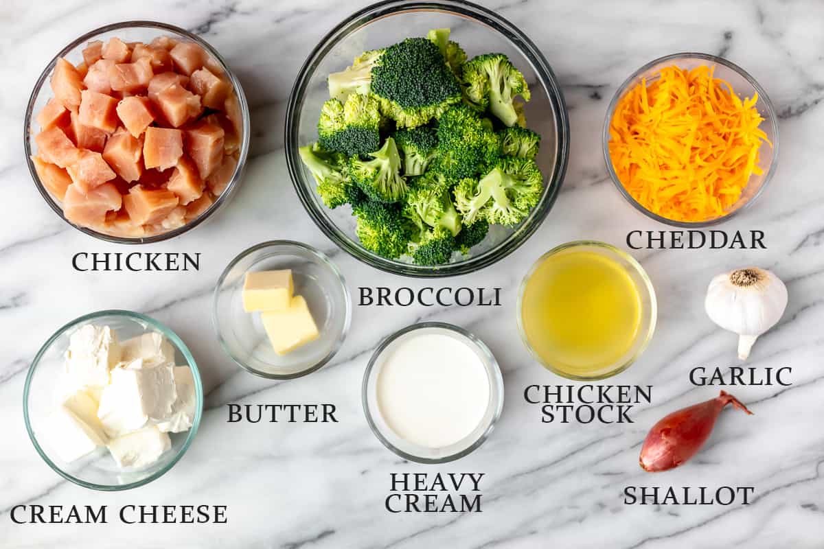 Ingredients needed to make keto chicken divan on a marble background with text overlay.