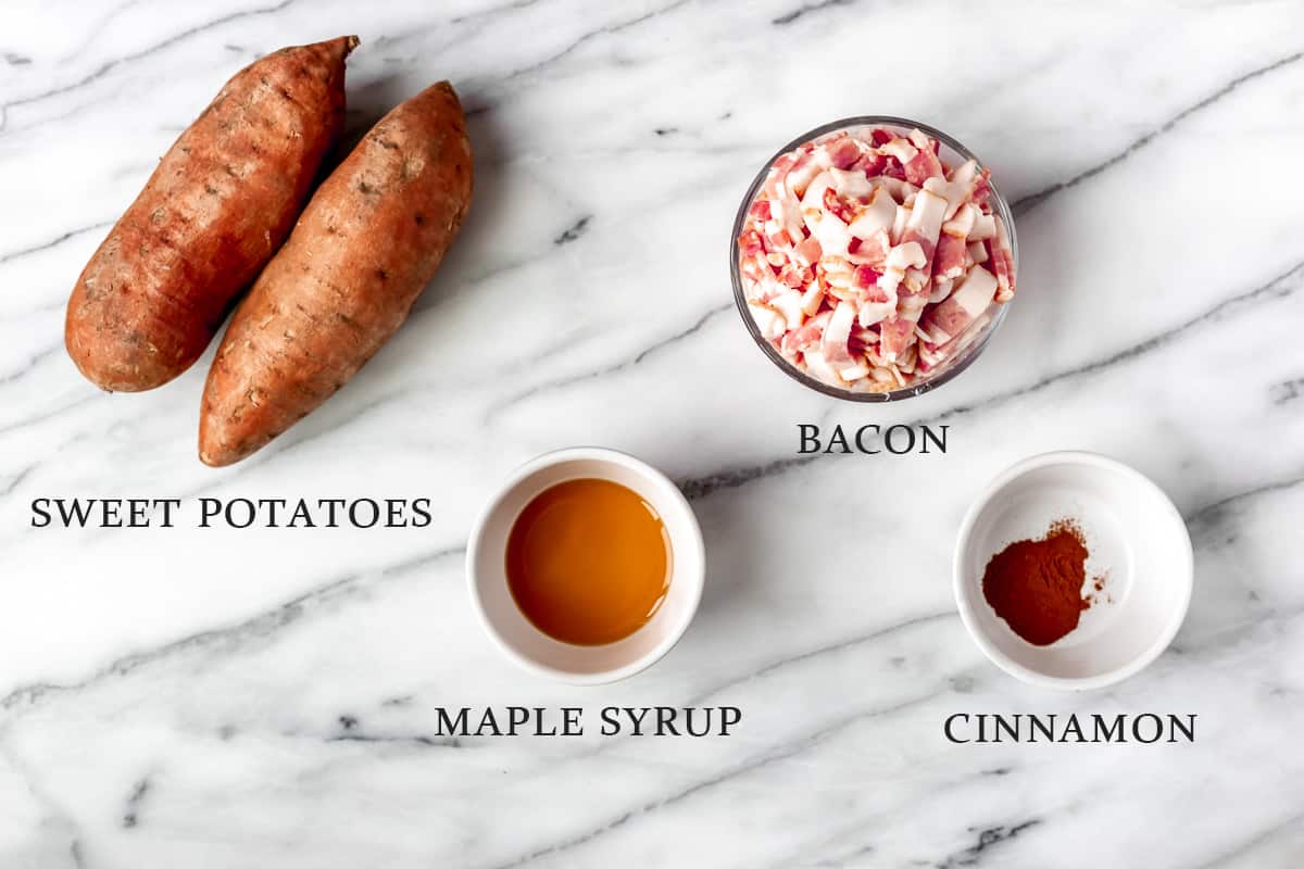 Ingredients needed to make maple bacon sweet potato hash on a marble background with text overlay.