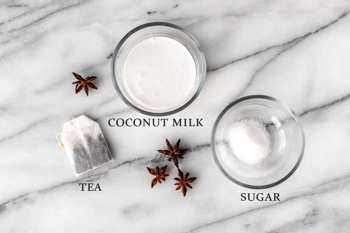 Ingredients needed to make a coconut chai latte with text overlay.