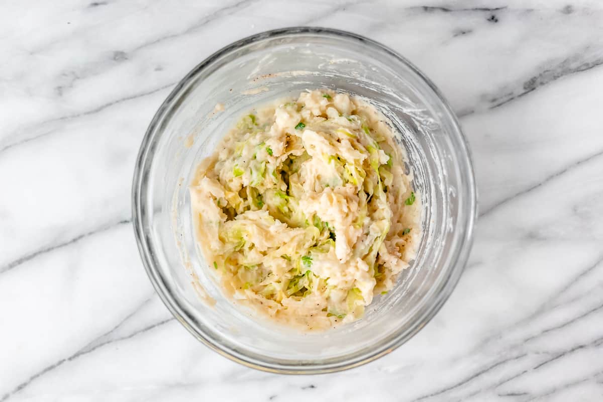 Colcannon blended together in a glass bowl.