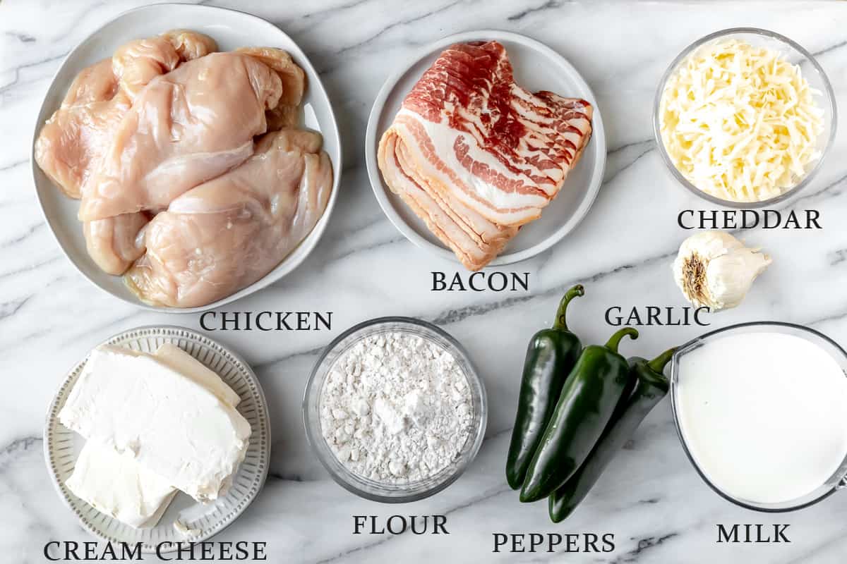 Ingredients needed to make jalapeno popper chicken pasta with text overlay.