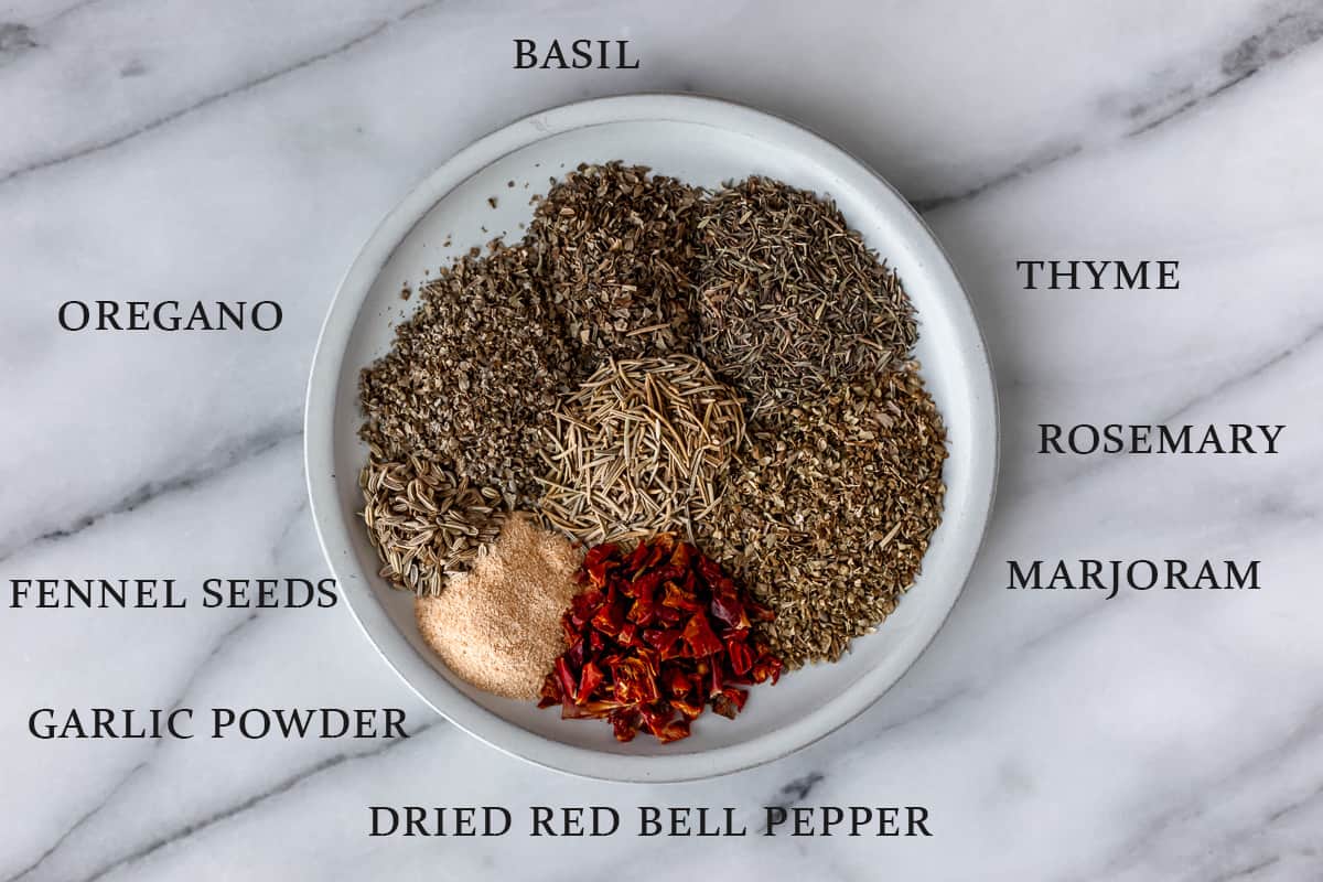 Ingredients needed to make Tuscan seasoning with text overlay.