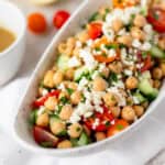 Mediterranean chickpea salad in a oval bowl.