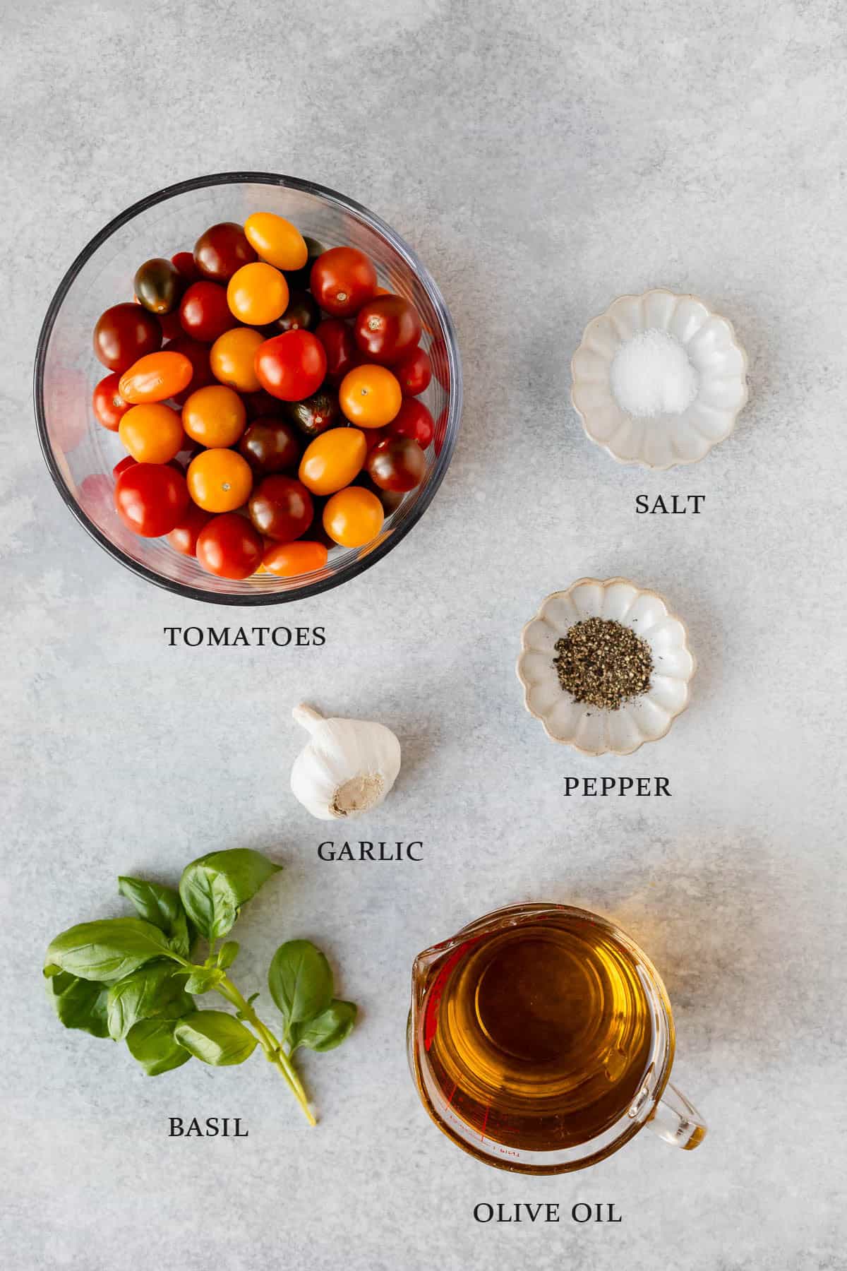 Ingredients needed to make cherry tomato confit on a white background with text overlay.
