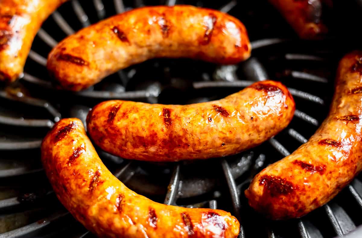 Itallian sausages on a grill.