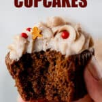 Close up of a gingerbread cupcake with a bite taken out of it with text overlay.
