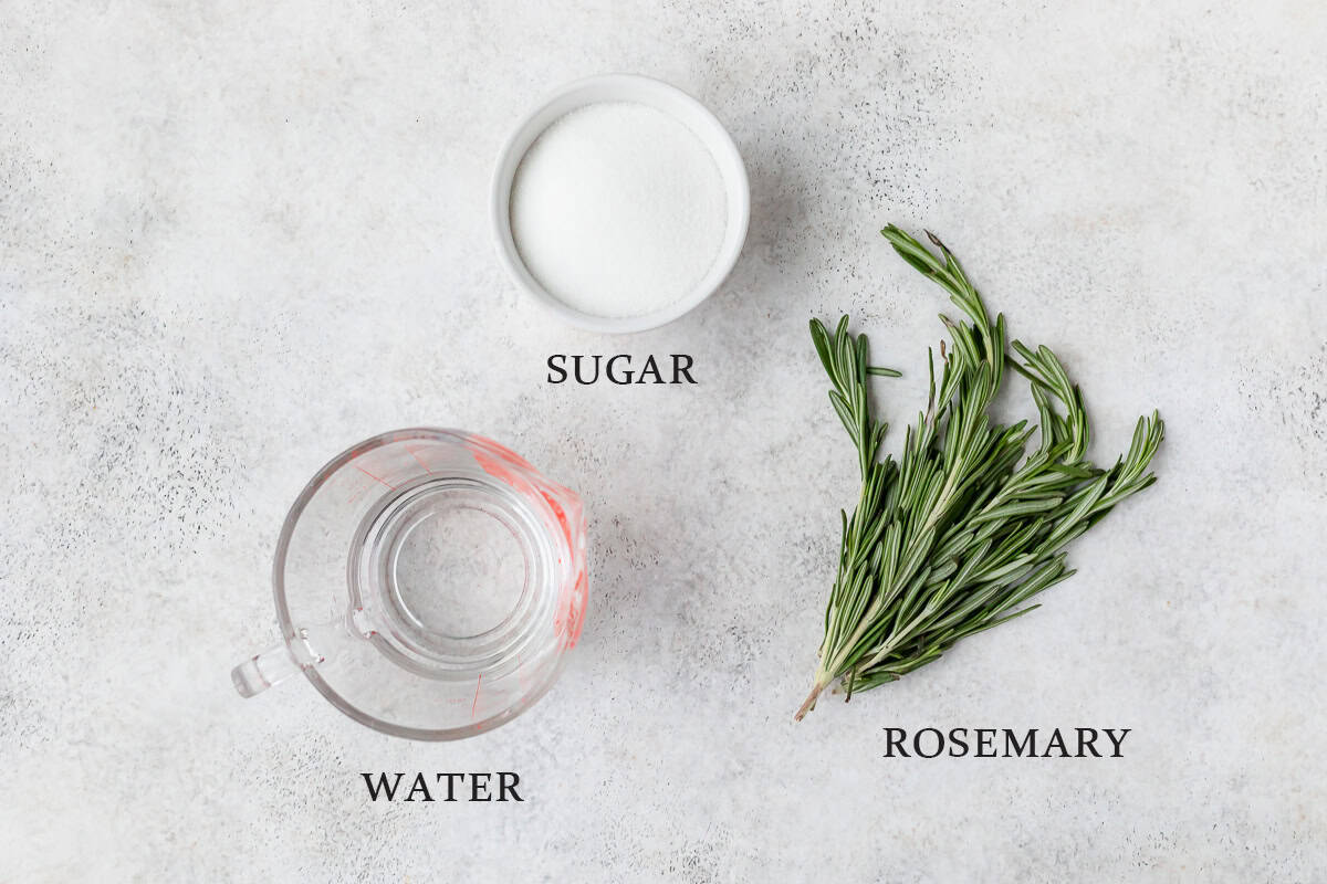 Ingredients needed to make sugared rosemary with text overlay.