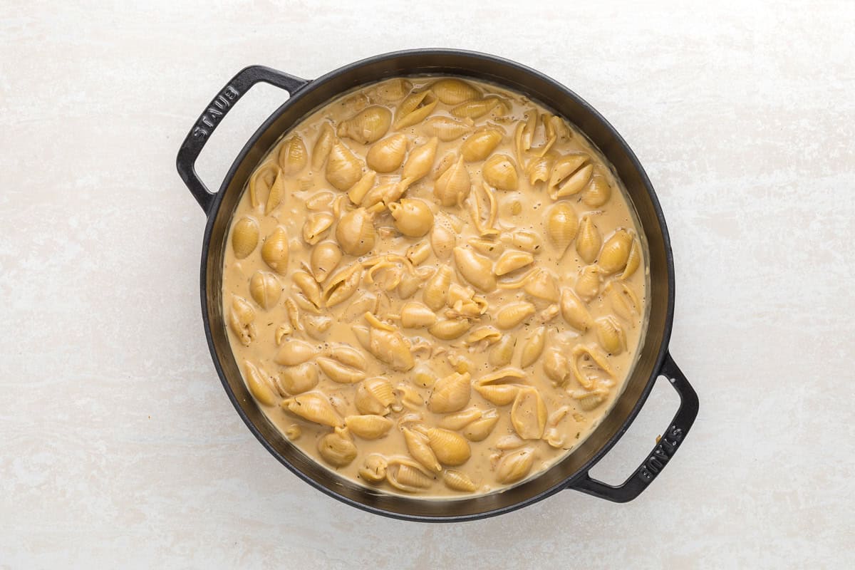 French onion shell pasta in a cast iron skillet.