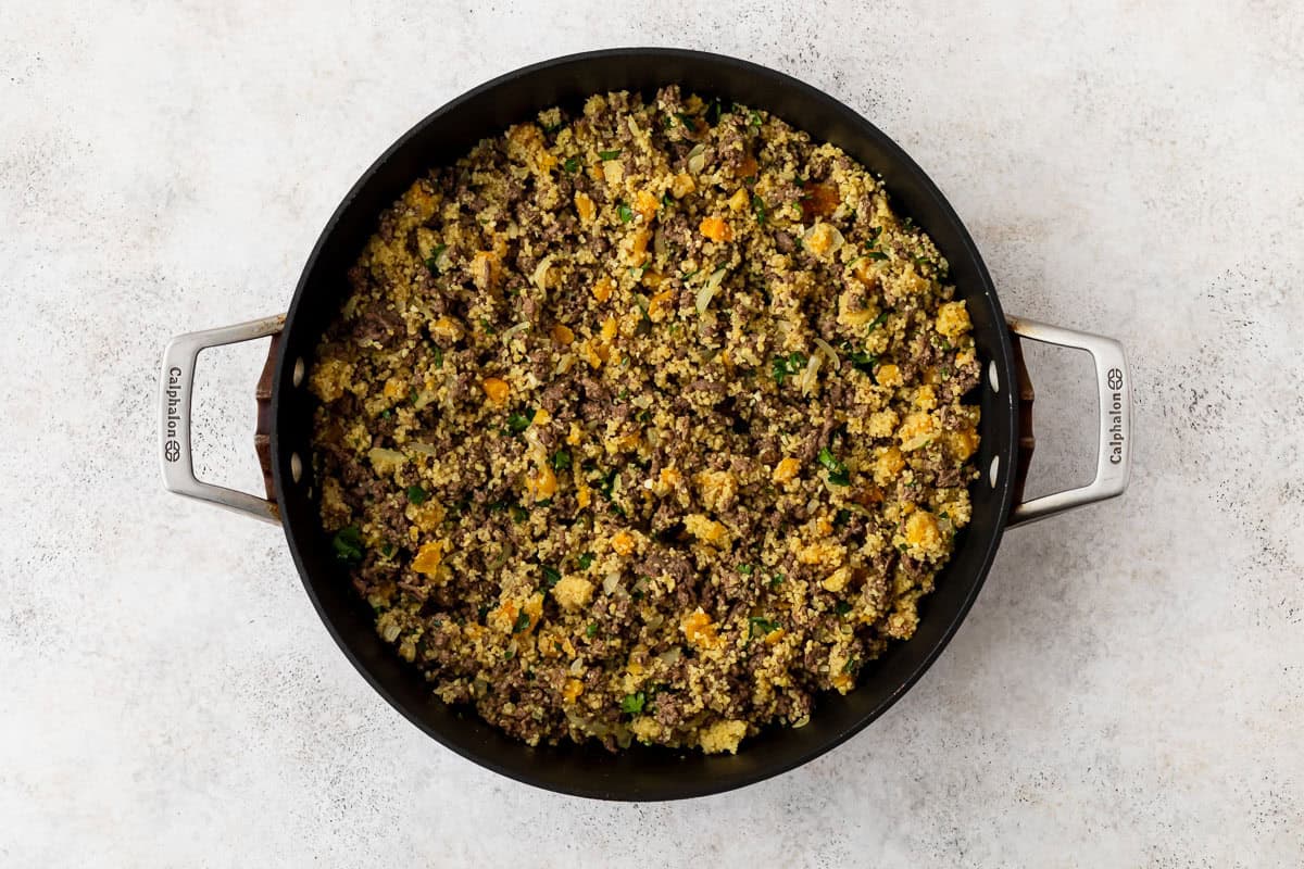 Ground beef, couscous and apricot mixture in a large, deep skillet.
