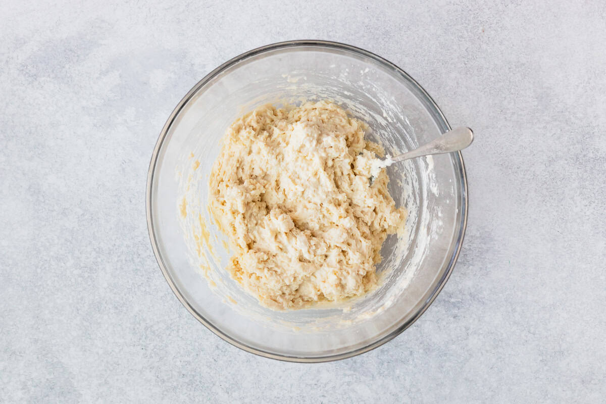 Scones dough in a glass bowl.